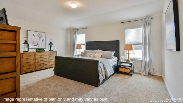 bedroom with light colored carpet