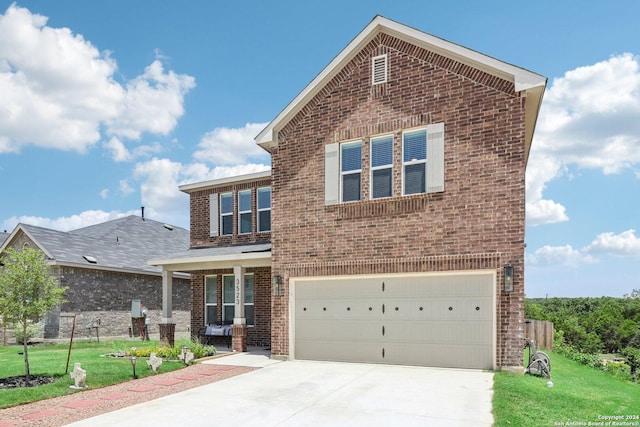 view of front of property with a front lawn and a garage