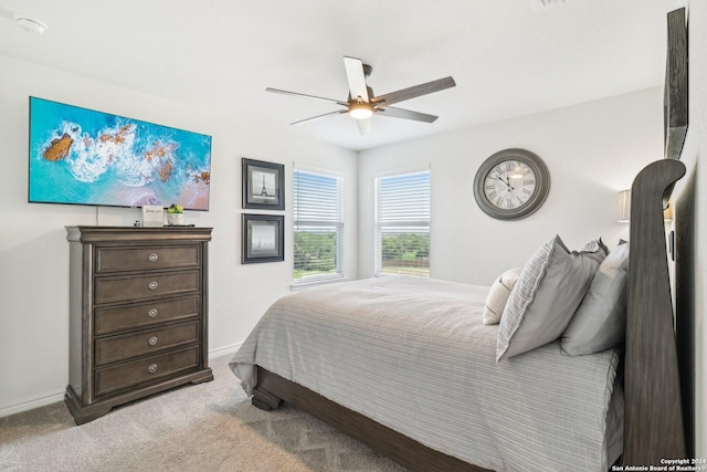 bedroom with light carpet and ceiling fan