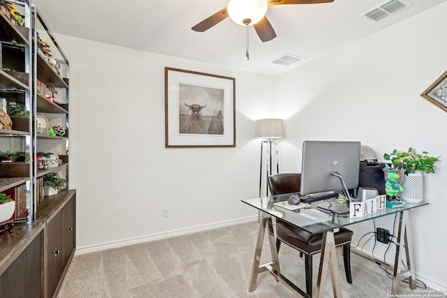 home office with ceiling fan and light colored carpet