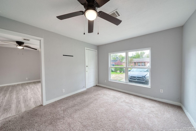 spare room with light hardwood / wood-style flooring