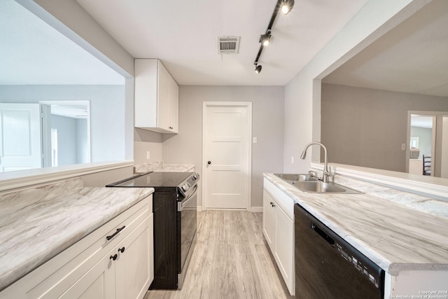 kitchen with light wood-type flooring, sink, white cabinetry, and black appliances