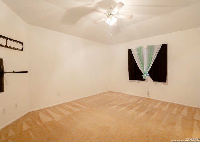 empty room with carpet floors and ceiling fan