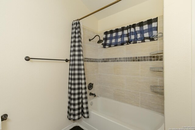 bathroom with shower / bath combination with curtain