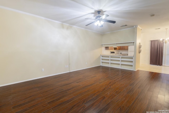 unfurnished room with ceiling fan with notable chandelier, dark hardwood / wood-style floors, and ornamental molding