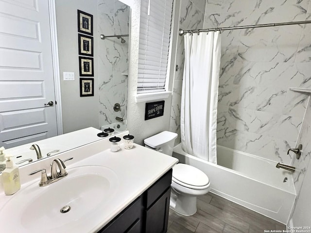 full bathroom featuring wood-type flooring, vanity, toilet, and shower / bath combo