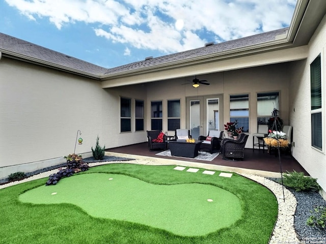 exterior space with outdoor lounge area, ceiling fan, and a patio