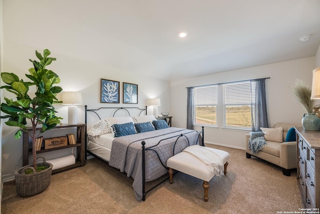 bedroom featuring light carpet