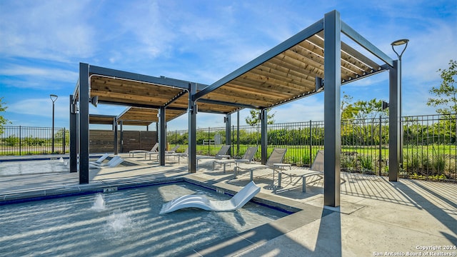 view of property's community featuring a patio and a swimming pool