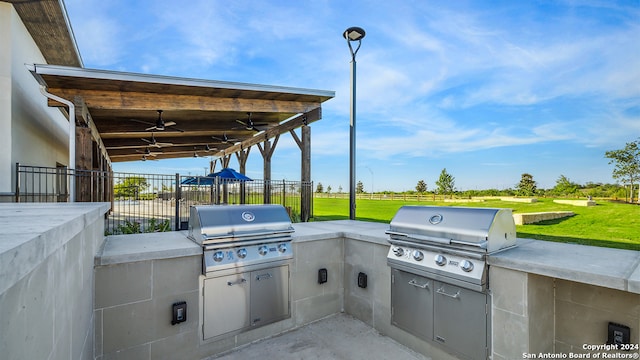 view of patio / terrace with area for grilling and ceiling fan