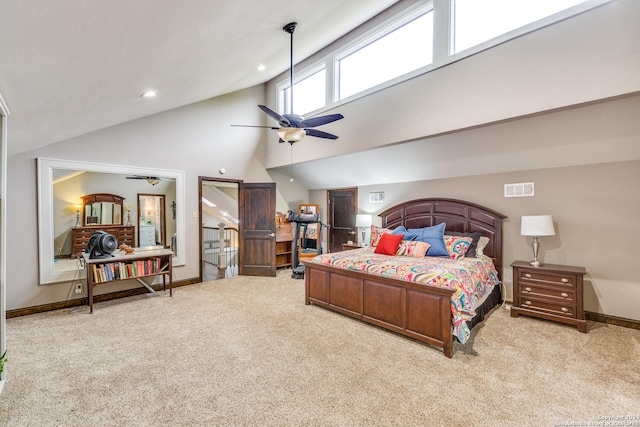 carpeted bedroom with ceiling fan and high vaulted ceiling