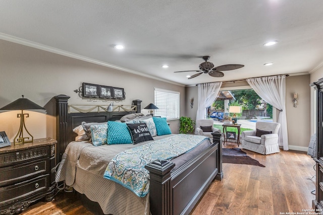 bedroom with ceiling fan, hardwood / wood-style floors, and crown molding