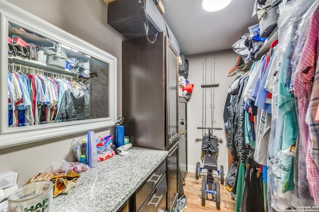 walk in closet featuring light hardwood / wood-style flooring