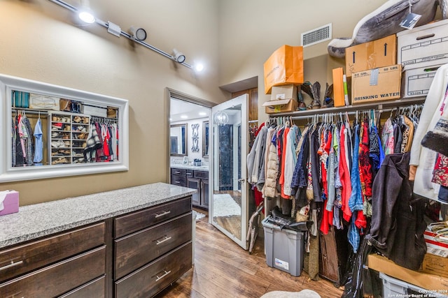 walk in closet featuring light wood-type flooring