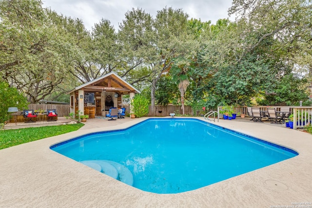 view of swimming pool featuring a patio