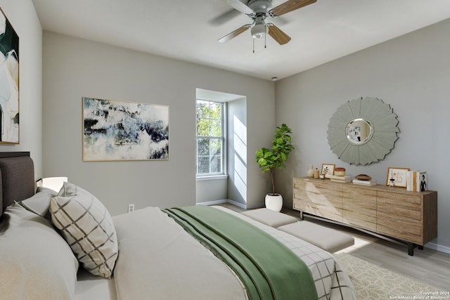 bedroom featuring ceiling fan and light hardwood / wood-style floors