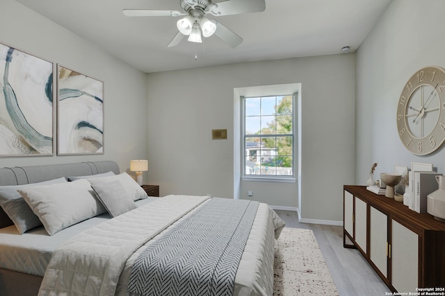 bedroom featuring light hardwood / wood-style flooring and ceiling fan