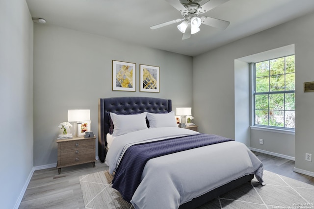 bedroom with hardwood / wood-style flooring and ceiling fan