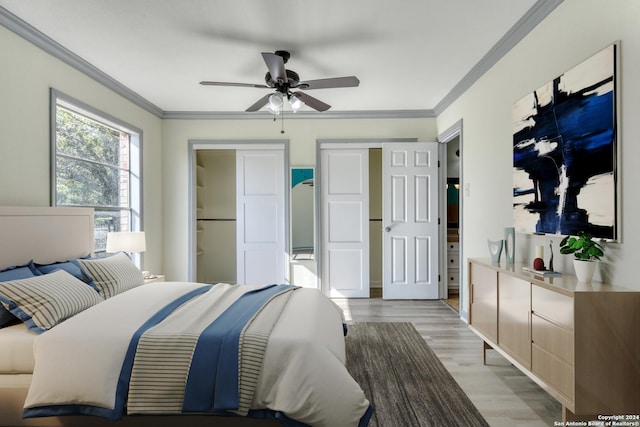 bedroom featuring ceiling fan, crown molding, and light hardwood / wood-style floors