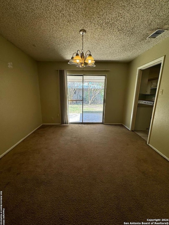 unfurnished dining area featuring a chandelier, a textured ceiling, and carpet floors