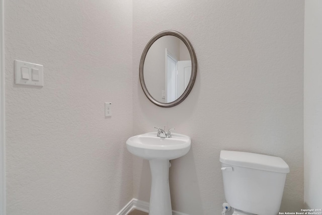 142 Ashley Loop, San Antonio, TX 78253 - half bathroom with toilet and a sink