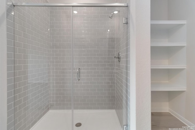 142 Ashley Loop, San Antonio, TX 78253 - bathroom with a stall shower and baseboards
