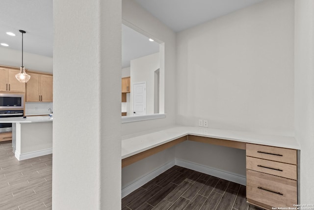 11423 Buffalo Bill, San Antonio, TX 78254 - unfurnished office featuring wood tiled floors, built in desk, and recessed lighting
