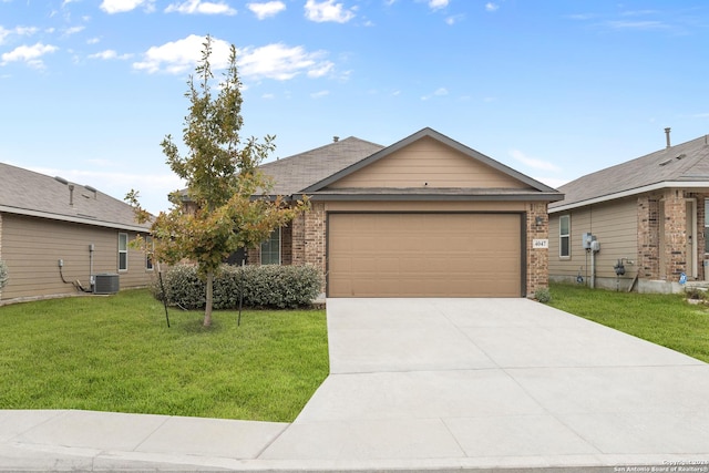 ranch-style house featuring a garage and a front lawn