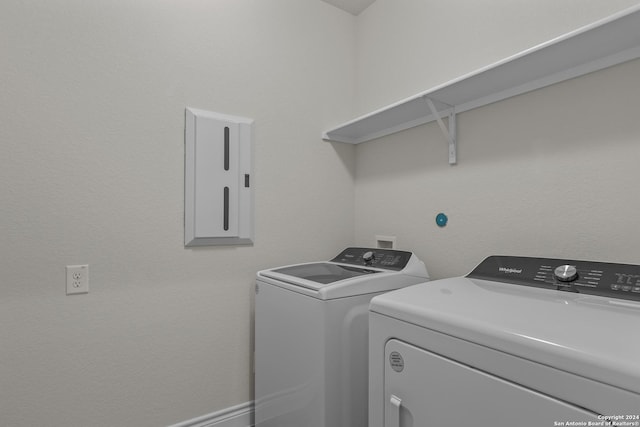 laundry room featuring separate washer and dryer and electric panel