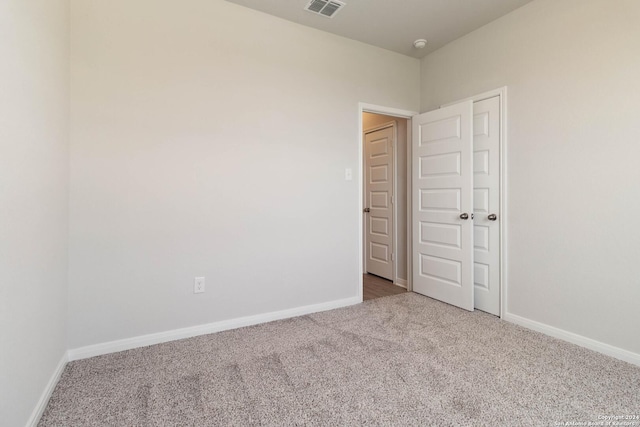 unfurnished bedroom featuring carpet flooring