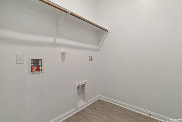 laundry room featuring hardwood / wood-style floors, electric dryer hookup, and gas dryer hookup