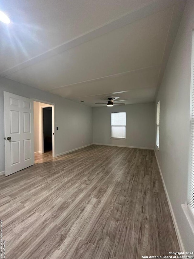 unfurnished room featuring ceiling fan and light hardwood / wood-style floors