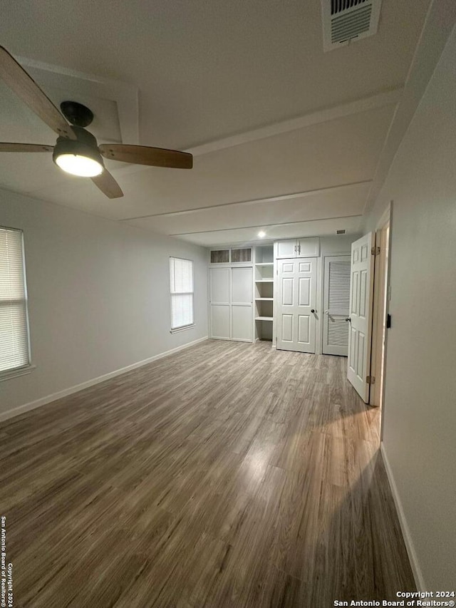 unfurnished room featuring hardwood / wood-style floors and ceiling fan