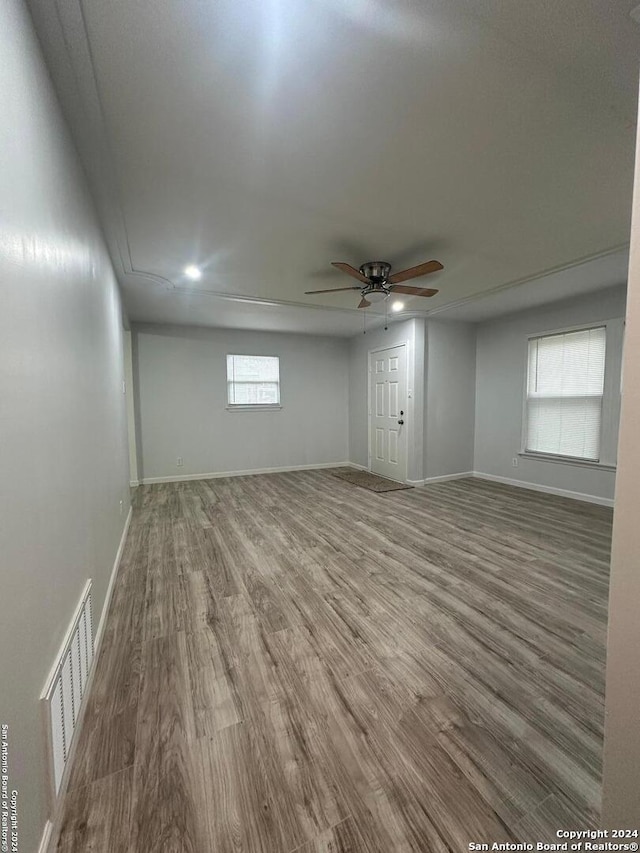 spare room featuring hardwood / wood-style floors and ceiling fan