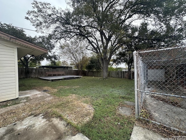 view of yard with a wooden deck