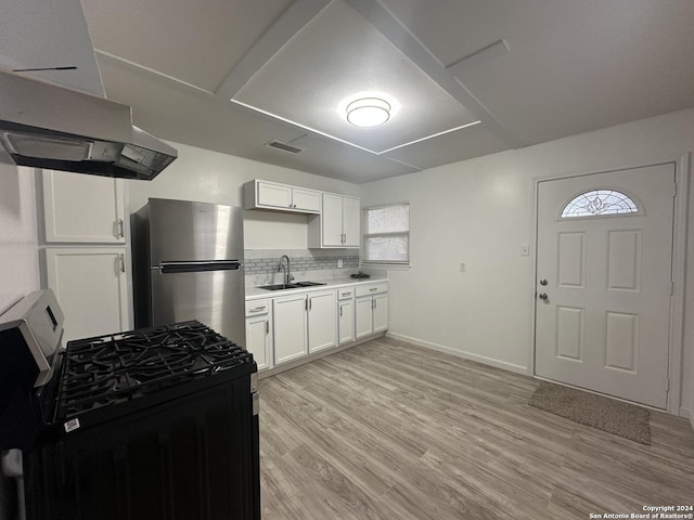 kitchen featuring white cabinetry, a wealth of natural light, light hardwood / wood-style floors, and appliances with stainless steel finishes