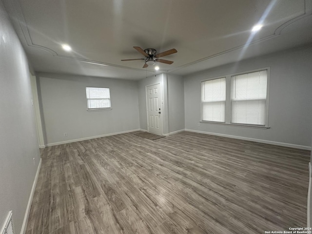 empty room featuring ceiling fan and hardwood / wood-style floors