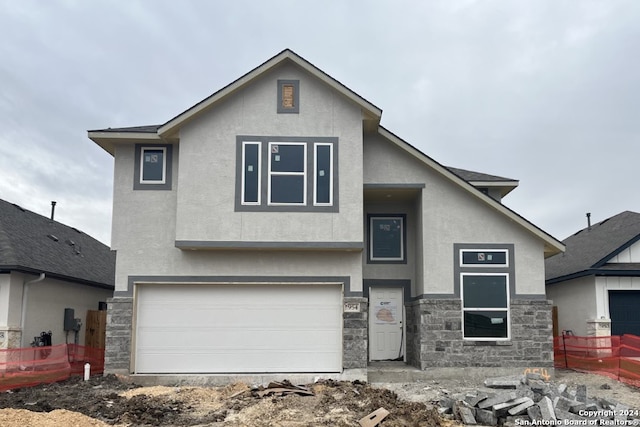 view of front of property featuring a garage