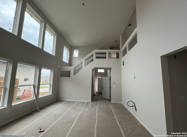 spare room featuring a high ceiling