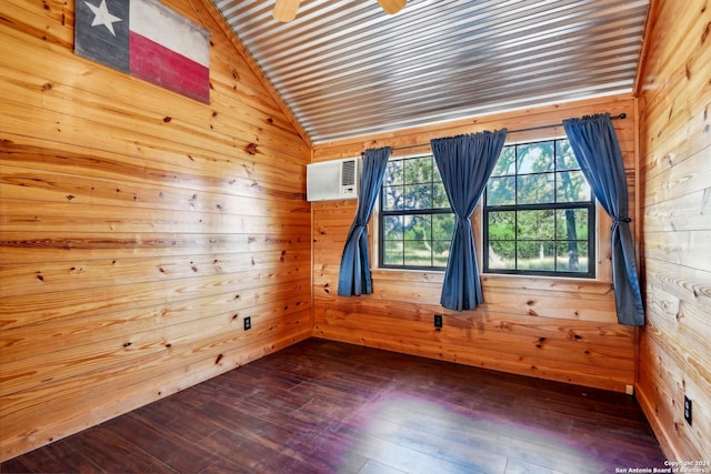 unfurnished room with dark wood-type flooring, an AC wall unit, lofted ceiling, wooden walls, and wood ceiling