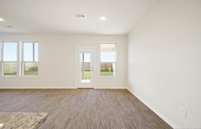 empty room featuring hardwood / wood-style flooring