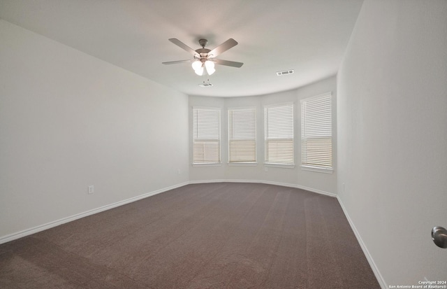 carpeted empty room with ceiling fan