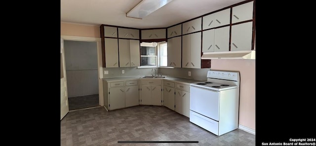 kitchen featuring white cabinets, white range with electric stovetop, and sink