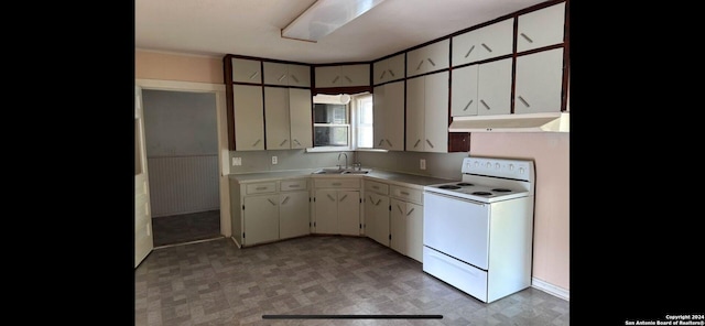 kitchen with white cabinetry, sink, and white electric range oven