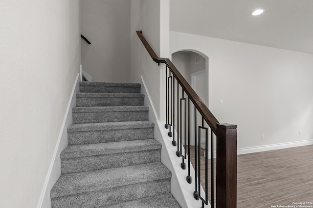 stairway featuring hardwood / wood-style flooring