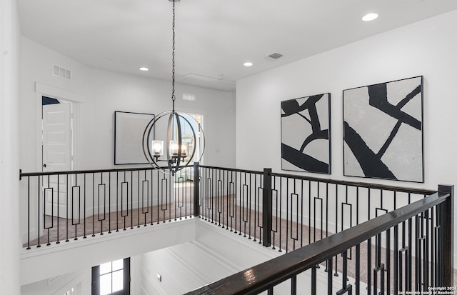 hallway featuring an inviting chandelier