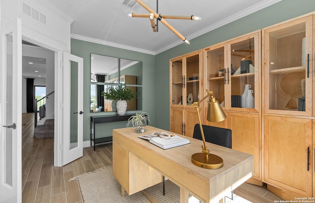 office area featuring hardwood / wood-style flooring, an inviting chandelier, and ornamental molding