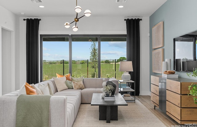 living room with plenty of natural light and light wood-type flooring