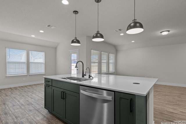 kitchen featuring sink, a center island with sink, dishwasher, light hardwood / wood-style floors, and hanging light fixtures