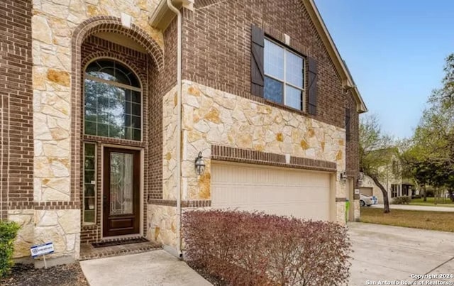 entrance to property featuring a garage